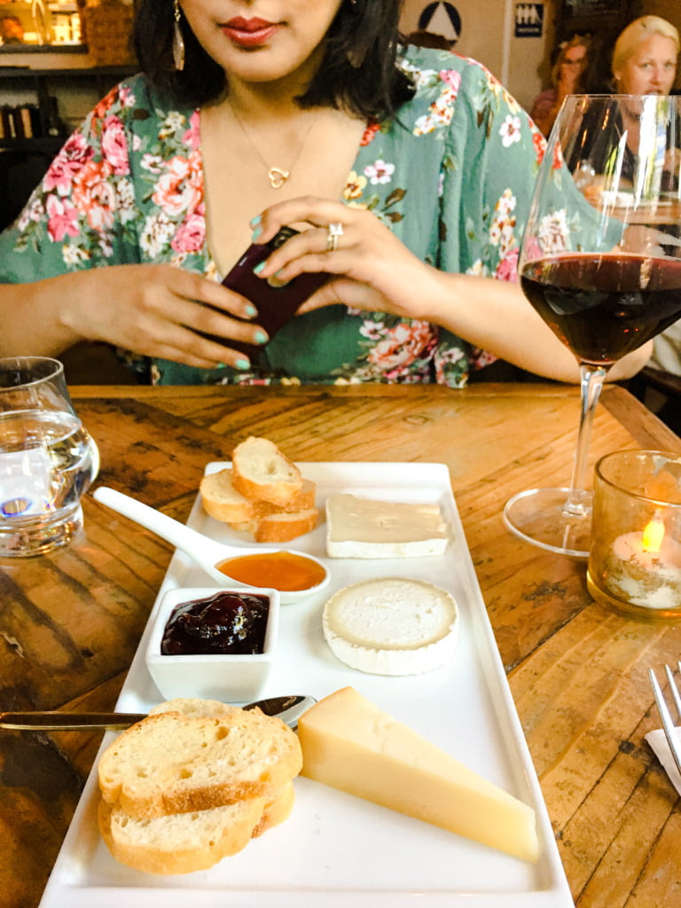 Charcuterie board and red wine in The Rind, one of the best restaurants in Midtown Sacramento