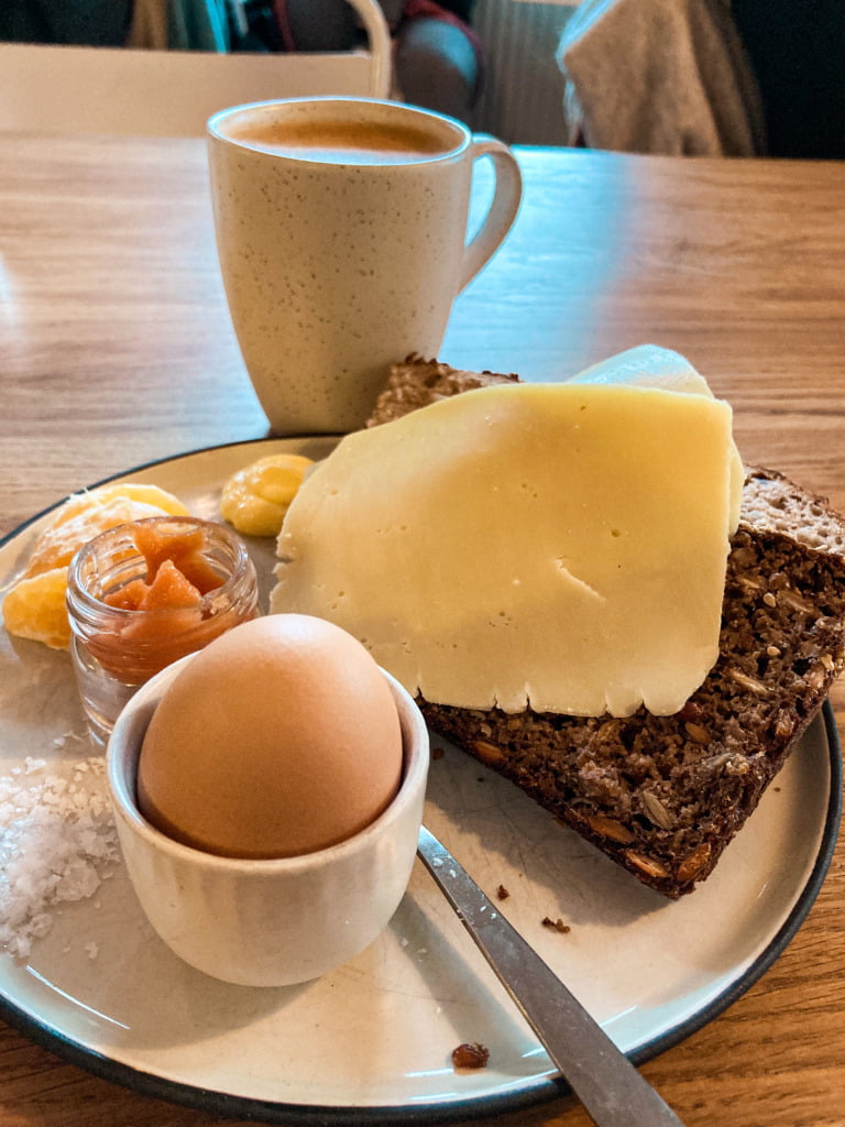 Mirabelle breakfast plate in Copenhagen, with egg, jam, cheese, and bread