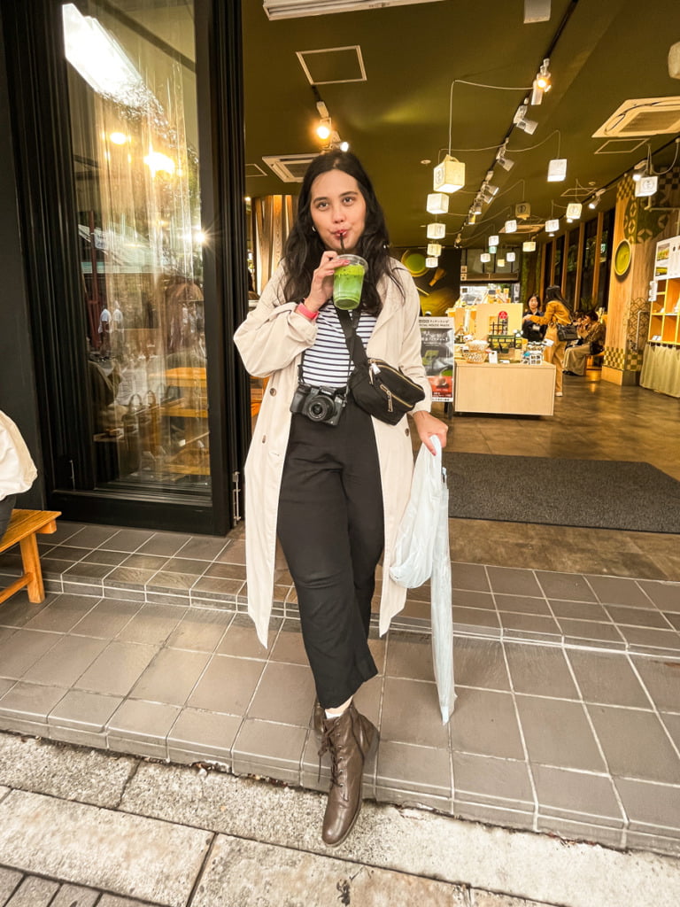 Woman drinking matcha iced tea at Kaminari Issa in Asakusa