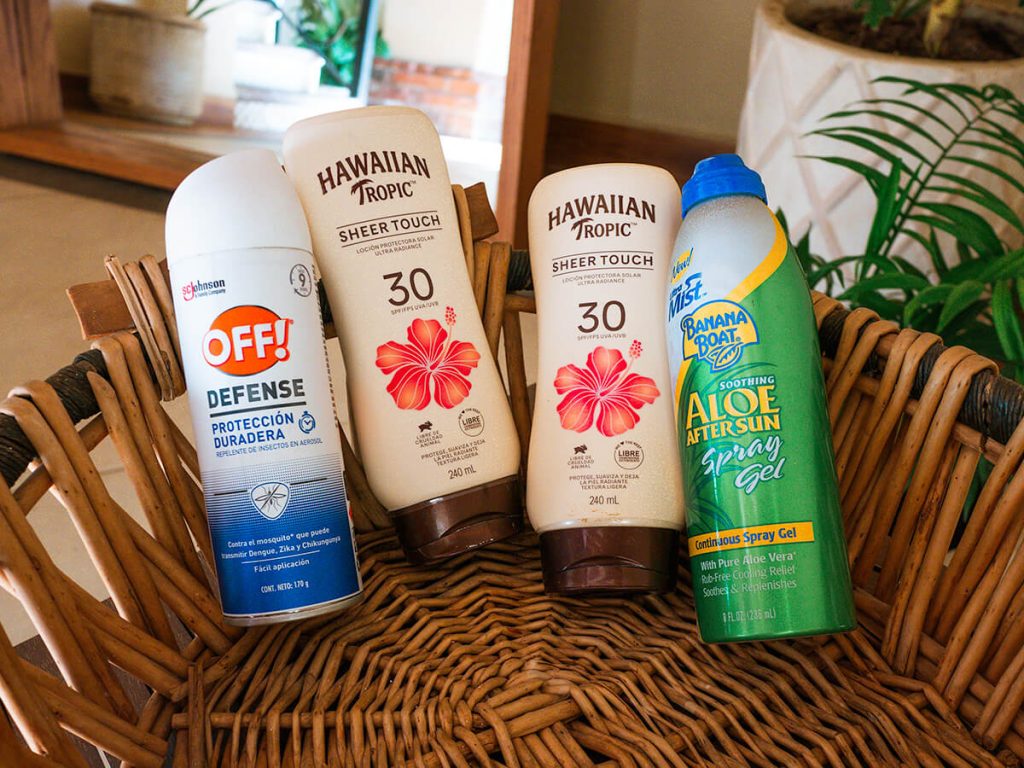 Basket of 2 bottles of sunscreen, 1 spray bottle of aloe gel, and 1 bottle of off bug spray. These are provided for guests in Casa Victoria Malecon, an adults-only guesthouse in Puerto Vallarta, Mexico, for when they go to the beach or hiking.