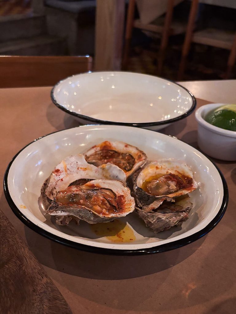 Oysters marinated with tabasco sauce in La Docena Oyster Bar and Grill in Puerto Vallarta, Mexico