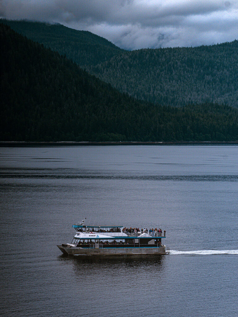 A small, tendered boat sailing from Holland America Line into Tracy Arm Fjord in Alaska