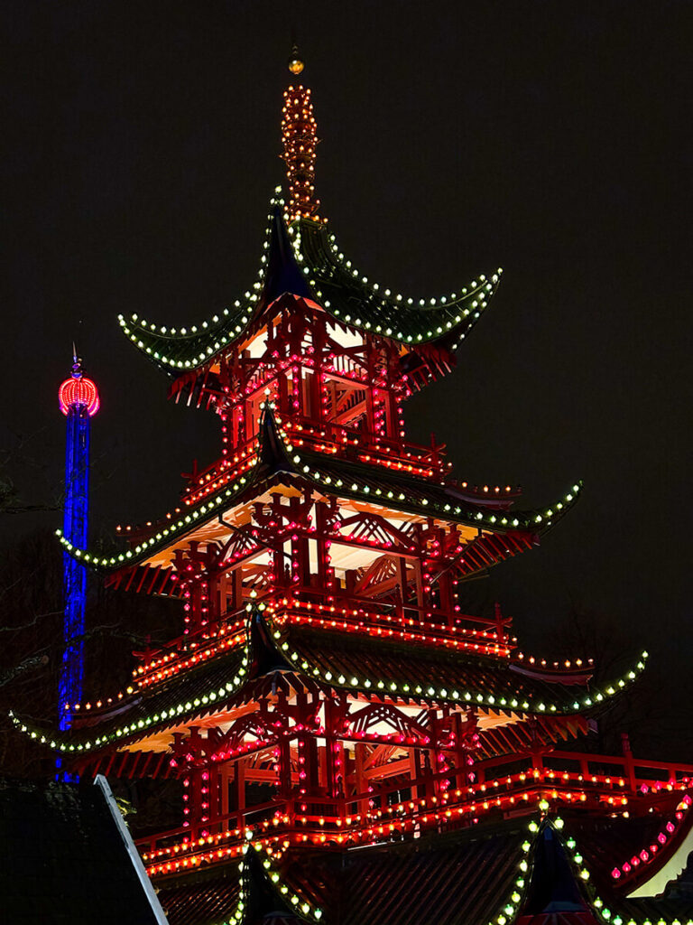 The Japanese pagoda at Tivoli Gardens in Copenhagen at night, with lights