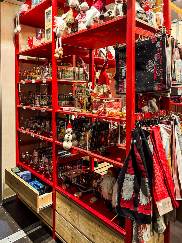 Bookshelf painted in red selling gnomes and other gifts at the Christmas market in Bergen, Norway